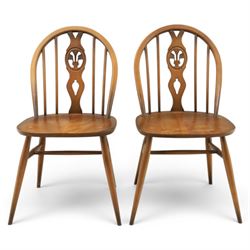 Ercol - Set of four dark elm 'Fleur De Lys' chairs