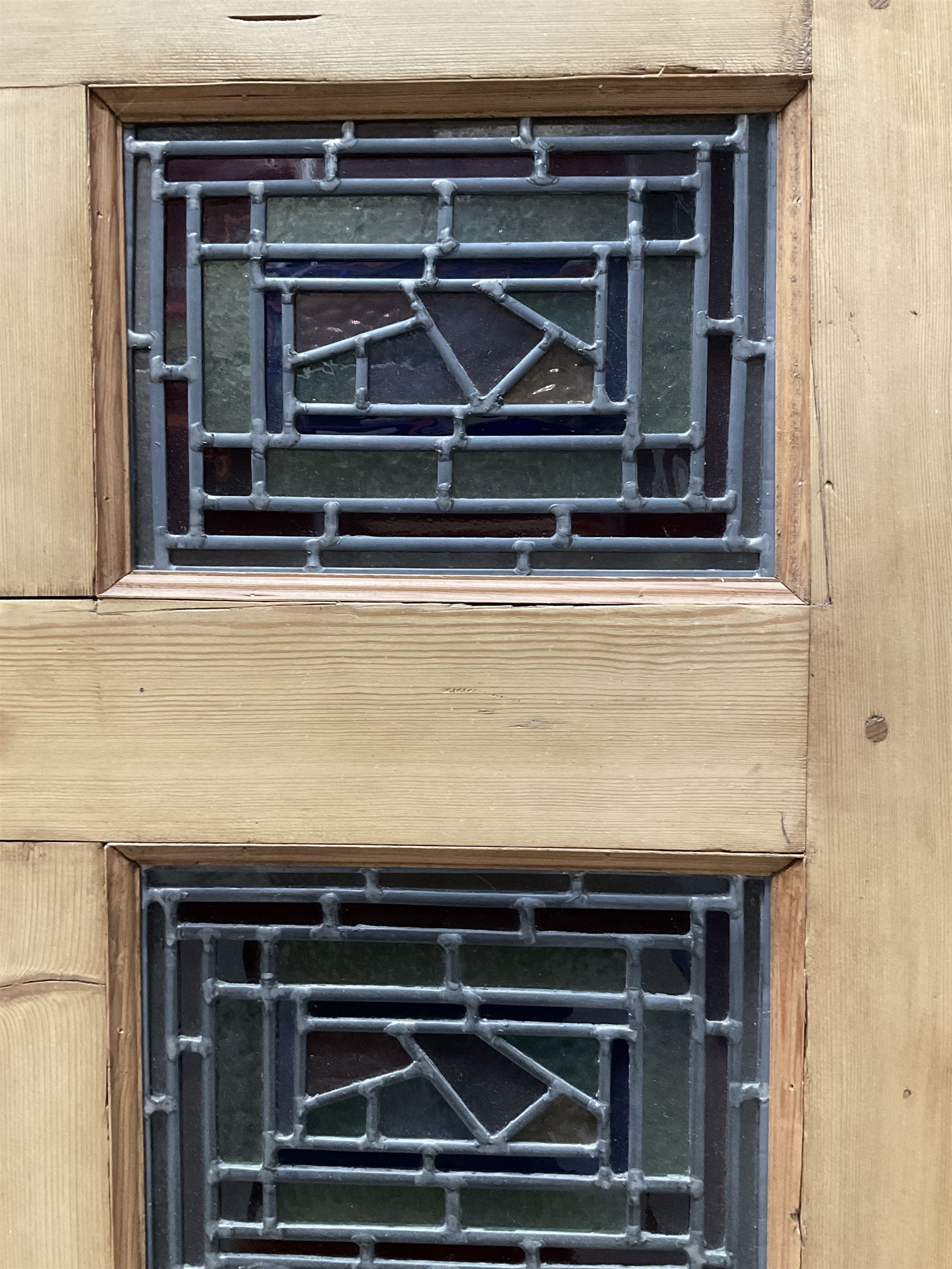 Early 20th century pine six panel door with later stained glass panels