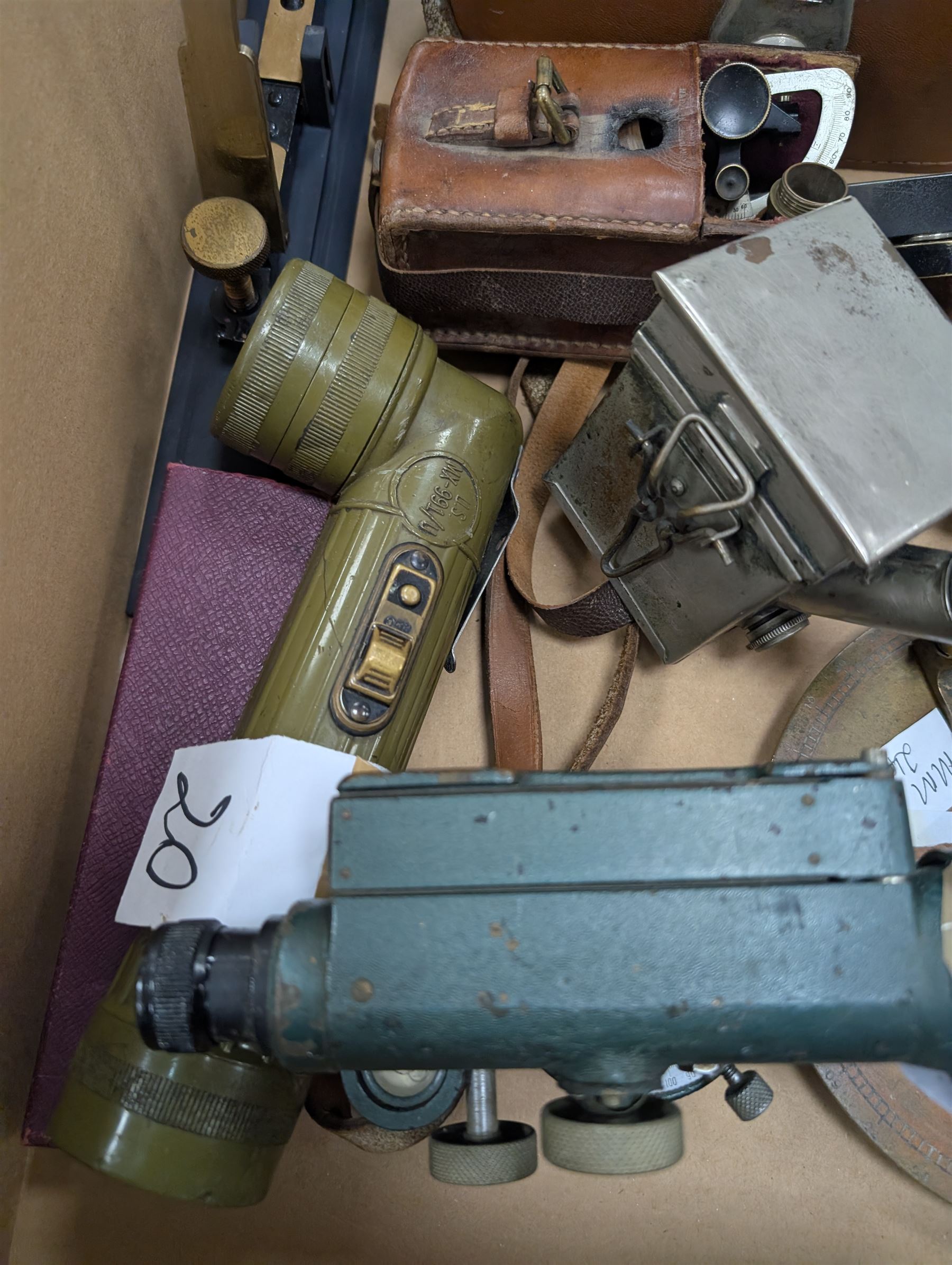 Two dumpy levels including Watts & Son ltd example and a Vickers Instruments example, US Navy bubble sextant, GT Price torch stamped US MX 991/U, 'The Unique' slide rule, three draw telescope and other instruments