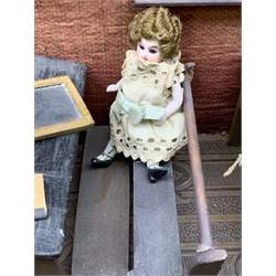 Late Victorian wooden school room setting with bisque head teacher and six German all bisque pupils each seated at a combined desk and chair with slate board, in a classroom furnished with chest of drawers, fire-surround, lectern, wall map, pictures, miniature books, school bell, chalk board on easel, wall clock etc, L70cm H28cm D28cm