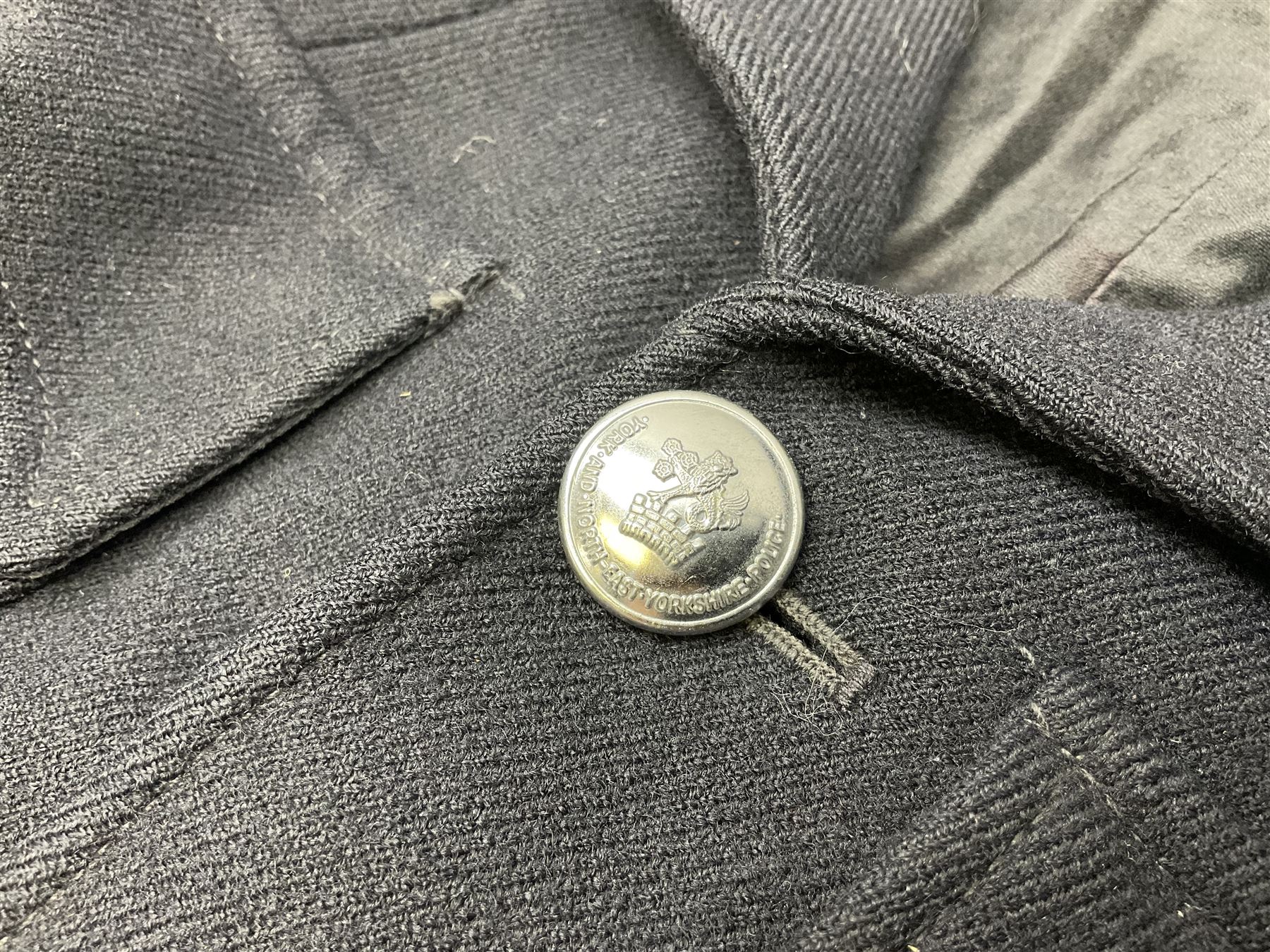 LNER Police cape; indistinctly dated 1943(?); York & North East Yorkshire Police belted tunic; belted tunic with Chief Constable epaulettes and buttons; and another tunic with staybrite Queens Crown buttons (4)