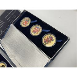 Singapore Venhonia commemorative medallion collection and a Tiger Beer commemorative three-medallion collection, both cased with certificates