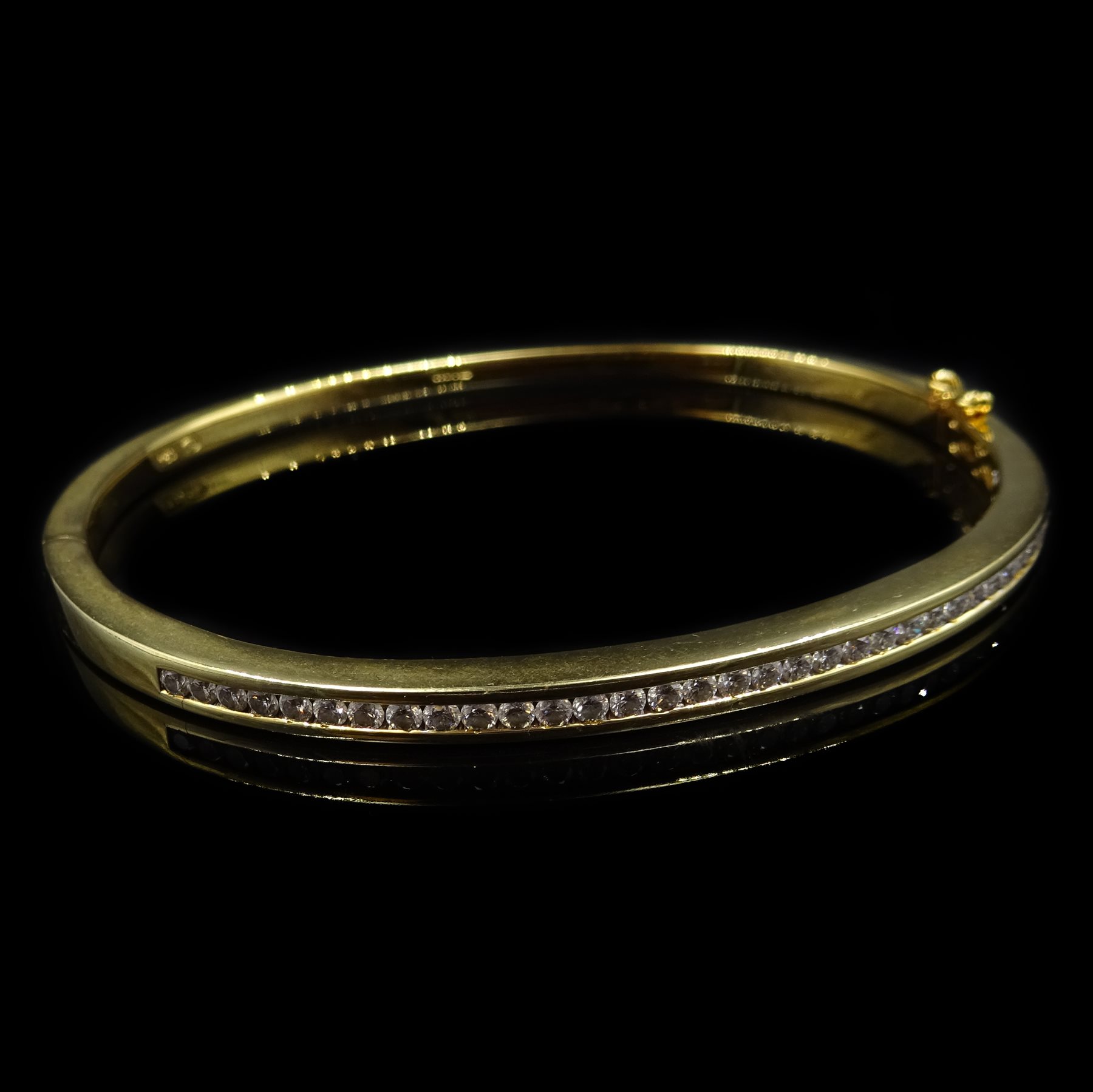 Channel set diamond gold hinged bangle, hallmarked 18ct - Fine Jewellery
