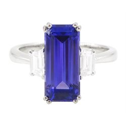 Platinum tanzanite and diamond three stone ring, single emerald cut tanzanite of approx 4....