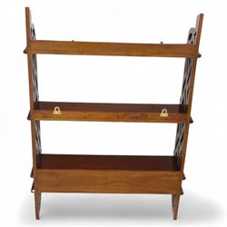 Two mahogany wall hanging items, comprising a French mahogany overmantel mirror with reeded uprights and moulded cornice (H 68cm, W 97cm, D 10cm), together with a mahogany wall shelf unit with three tiers and fretwork sides, the lower section fitted with three small drawers (H 95cm, W 63cm, D 18cm) (2)