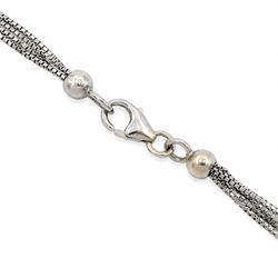 18ct white gold multi gemstone cross pendant necklace, vari-cut stones including emerald, ruby, pink and blue sapphire, red and blue stones, on a four strand box link chain necklace, stamped 750