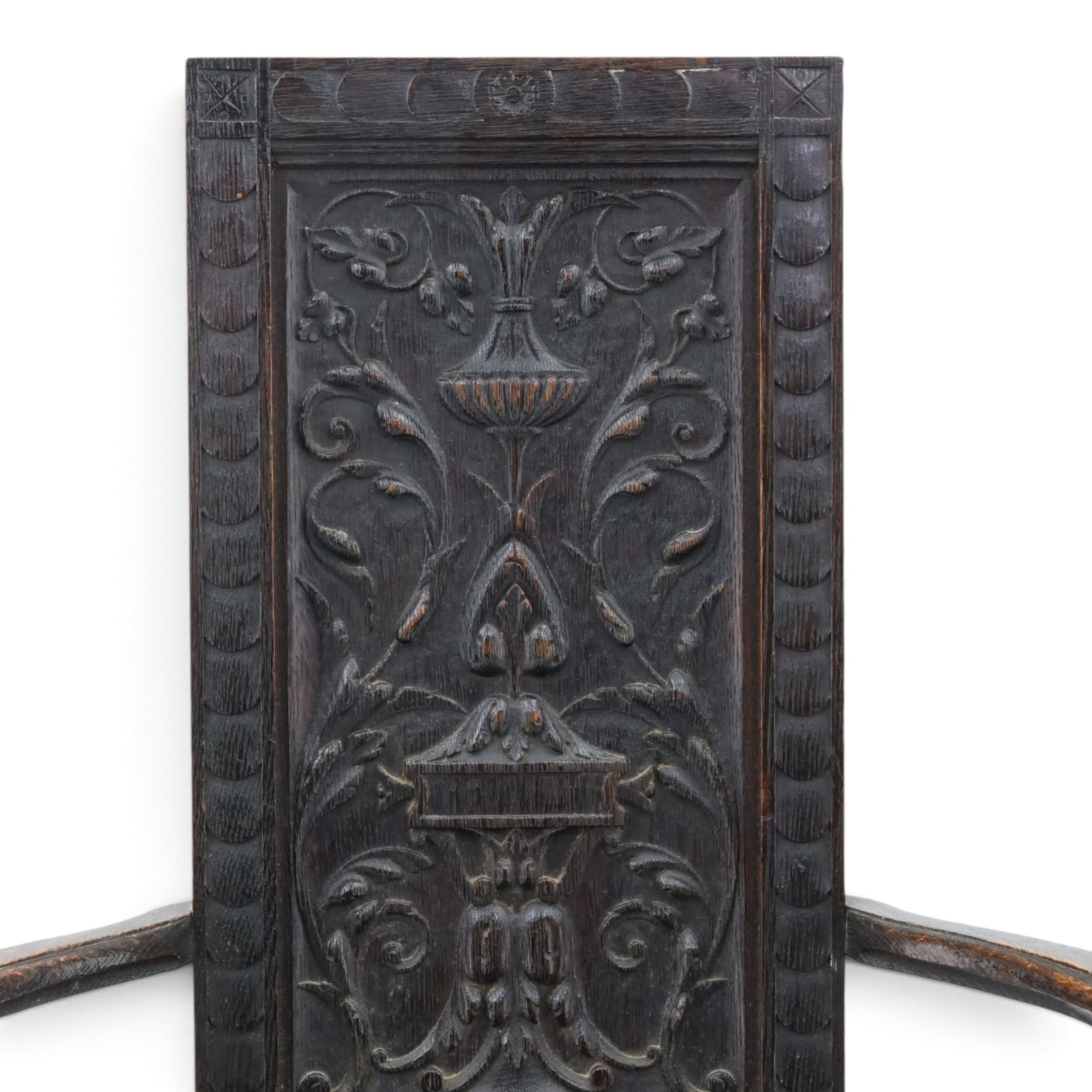 17th design century carved oak hall chair, carved back with urn and foliate details, shaped seat and arms, raised on turned supports united by stretchers