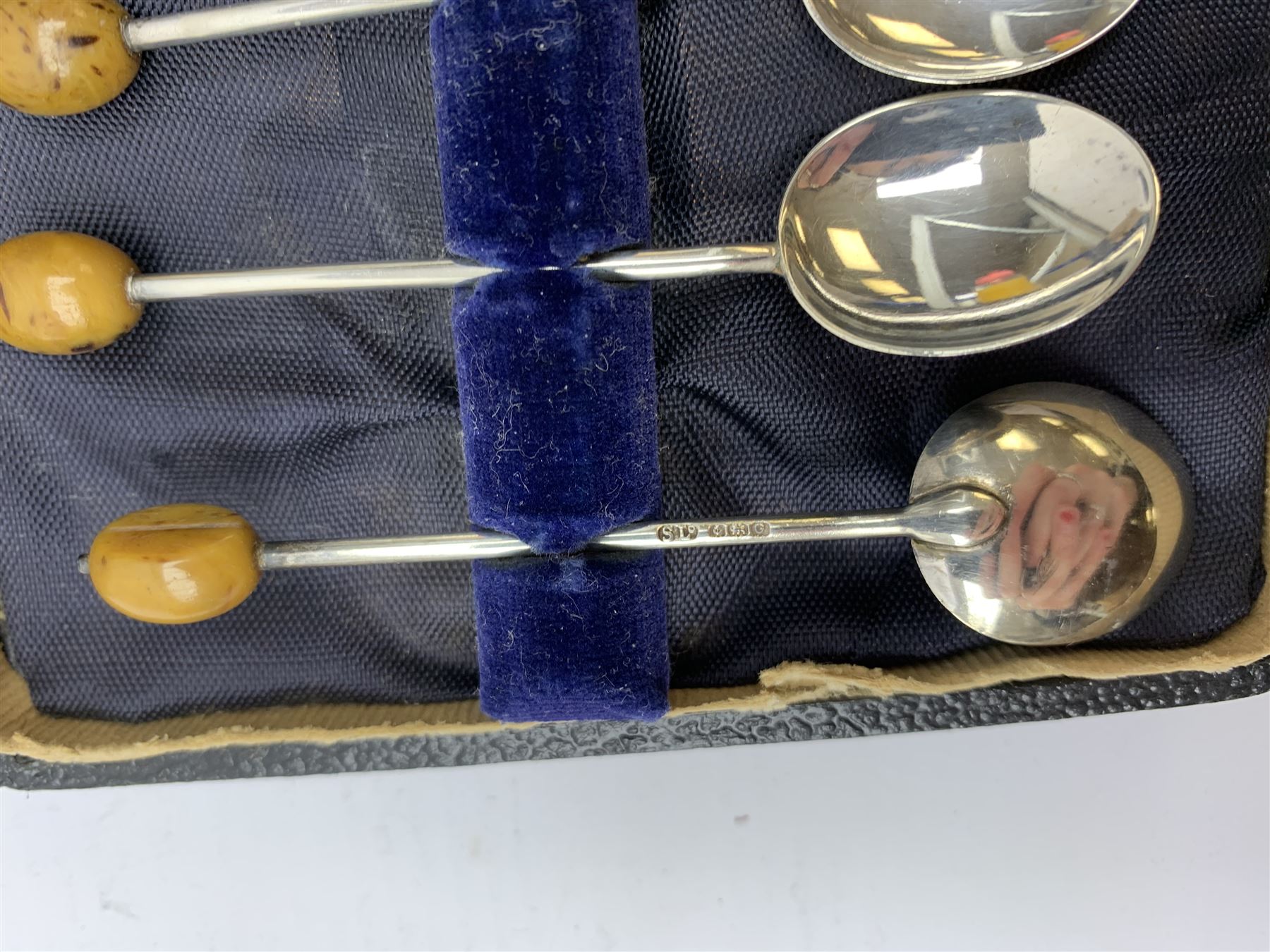 Two silver napkin rings by Collingwood & Sons Ltd, Birmingham 1928 and two other silver napkin rings hallmarked, approx 3.2oz, cased set of silver silver handled knives, hallmarked Sheffield 1915, together with a selection of silver plated flatware, to include Walker and Hall fish eaters set, cased nut cracker set with grape scissors, etc., plus a silver mounted hair brush and hand held mirror, hallmarked Chester 1919