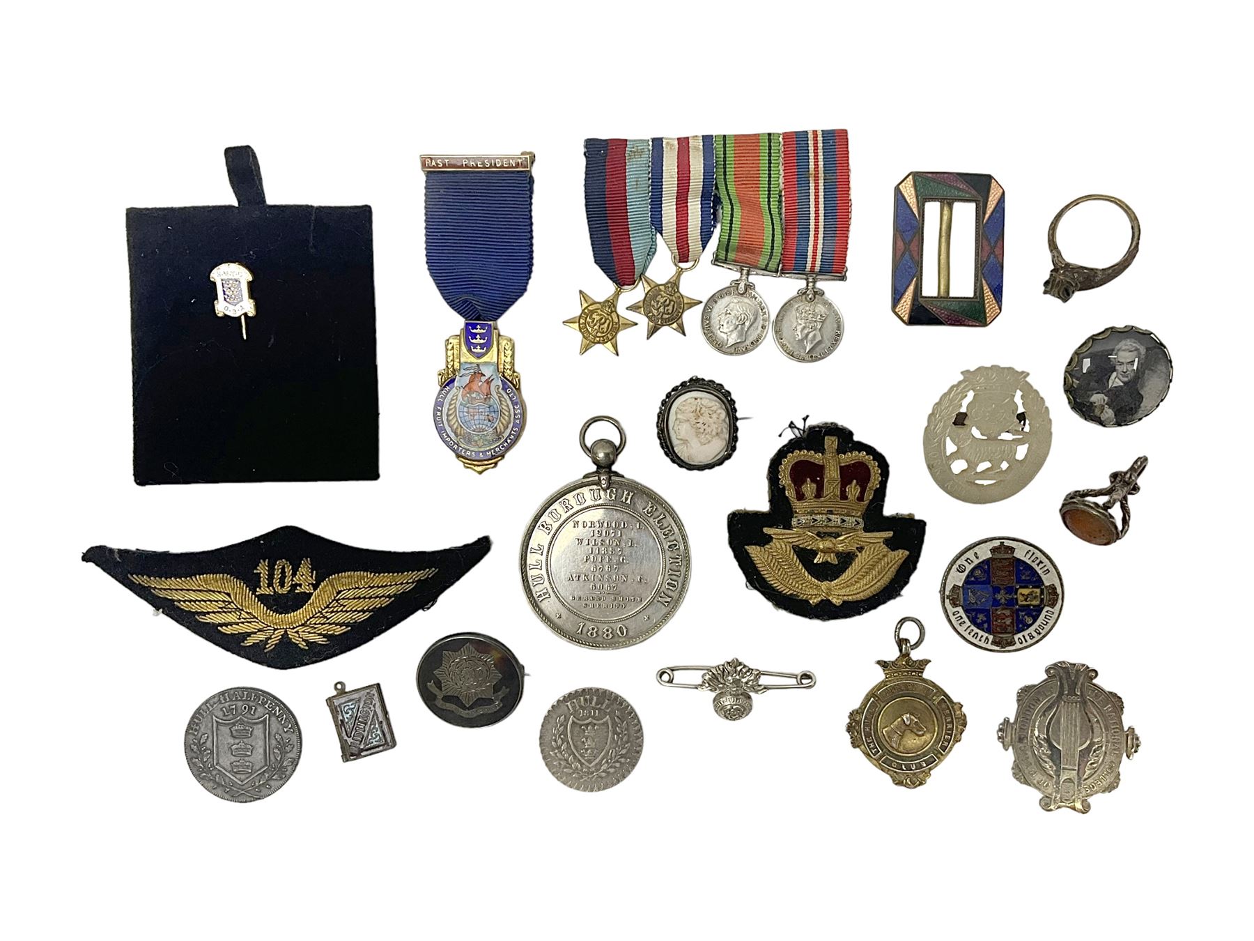 Collectables, to include enamelled Gothic Florin, Hull Rudston and Preston 1811 one shilling six pence token, silver gilt Hull Airedale Terrier Club fob, silver and tortoiseshell badge inscribed East Yorkshire beneath Yorkshire Rose, polychrome enamel buckle, mother of pearl badge carved with rose and tiger and inscribed York & Lancaster, etc.