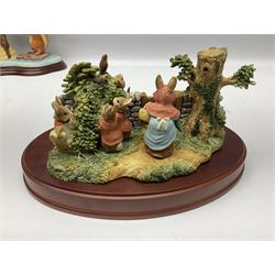 Four Border Fine Arts Beatrix Potter figures, comprising Tableau created to commemorate the Millenium together with a Border Fine Arts Limited Edition no 669814, The Tale of Peter Rabbit Tablet A1306, Four Little Rabbits A2442 and Sailing Home A2443
