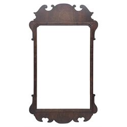 George II walnut mirror, shaped fretwork frame with moulded inner slip, bevelled plate