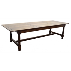  Large oak refectory dining table, panelled top on ring turned supports joined by an H stretcher, L289cm, H76cm, D107cm  