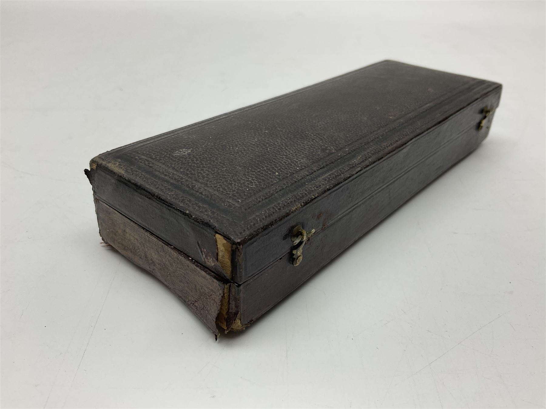 Late 19th/early 20th century boxwood and brass clinometer rule by Stanley, with inset magnetic compass, screw action protractor hinge divided to one degree with rise in inches per yard scale under, spirit level to one edge, marked 'W.F. Stanley Great Turnstile Holborn' with tables of distances, angles and thickness H16cm closed: in original leather covered case with instructions