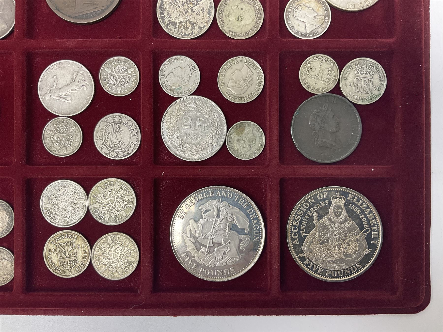 Great British and World coins including King George V 1935 crown, various silver three pence pieces, United States of America 1944 quarter dollar etc, housed in a coin tray