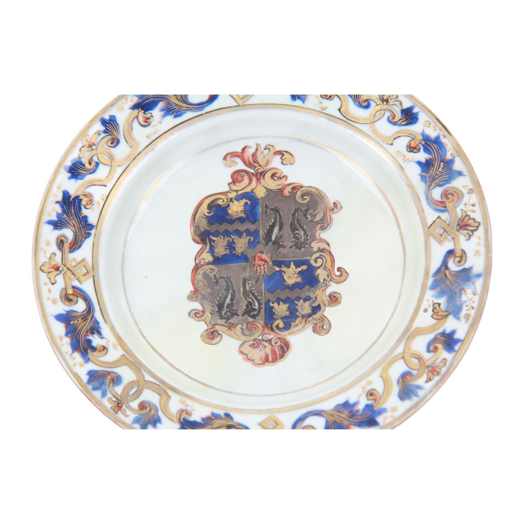 Early 18th century Chinese Imari armorial plate, circa 1720, painted with central arms of Fellowes quartering Coulson, surrounded by a European leaf scroll to the rim and heightened with gilt throughout, D22cm

Cf. Comparable pair of plates:
Lot 253, Benjamin F. Edwards III collection of Chinese Export, Christie's, 20th January 2004

Footnote: Sir John Fellowes was born in 1670, and was director and sub Governor of the South Sea Company. He became a baronet in 1719 and resided at Carshalton in Surrey. It is believed that this service would have been ordered in around 1719 or 1720

