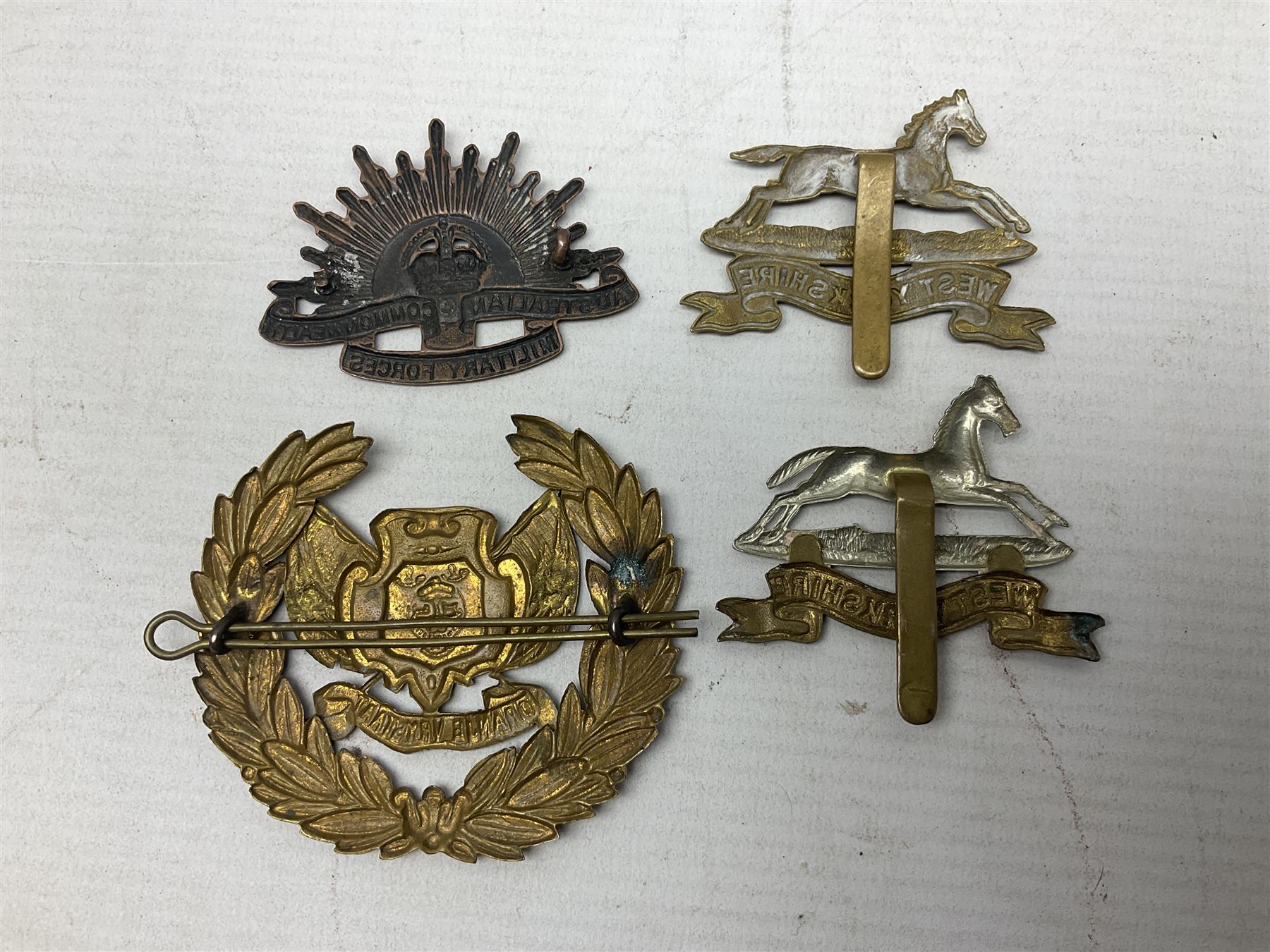 South African Army Orange Free State Artillery badge; three Commonwealth badges; and twelve Yorkshire/Lincolnshire badges including East Yorkshire, West Riding, York and Lancaster, West Yorkshire etc (16)