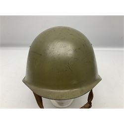 Two 1960s East Block Soviet style helmets - Czechoslovakian and Russian; both with liners (2)