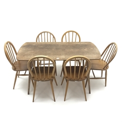  1950s Ercol rectangular dining table, square tapering supports (W137cm, H71cm, D71cm) and set six stick back chairs, turned supports (W40cm)   