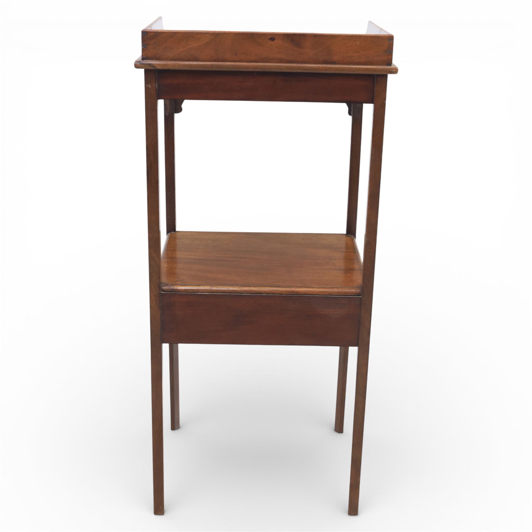 George III mahogany two tier night stand, rectangular tray top with three quarter gallery and shaped cut corners, pierced fret brackets to the apron, fitted with a single drawer to the lower tier, raised on slender square section legs