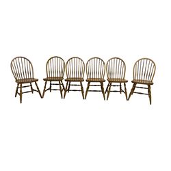 Set six beech dining chairs, hoop and stick back, shaped seat over turned supports joined by turned stretchers 