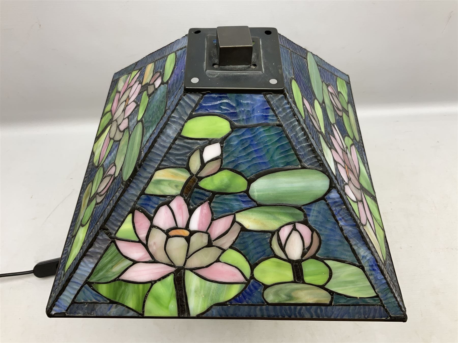 Tiffany Pond Lily style table lamp and shade with leaded panels of green, pink and rippled blue water effect ground, raised upon brushed metal base, H50cm