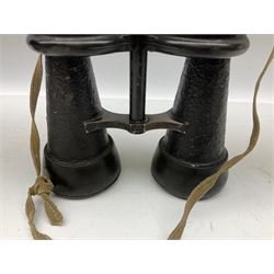 Pair of WWII German U-boat binoculars probably 7 x 50 by Leitz, with rubber eye piece protector covers and leather case stamped with Kriegsmarine mark to the lid and dated 1944, with leather strap.