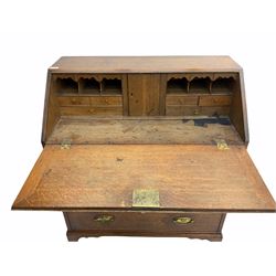Late 18th century oak bureau, fall front over three long graduating drawers, on bracket feet