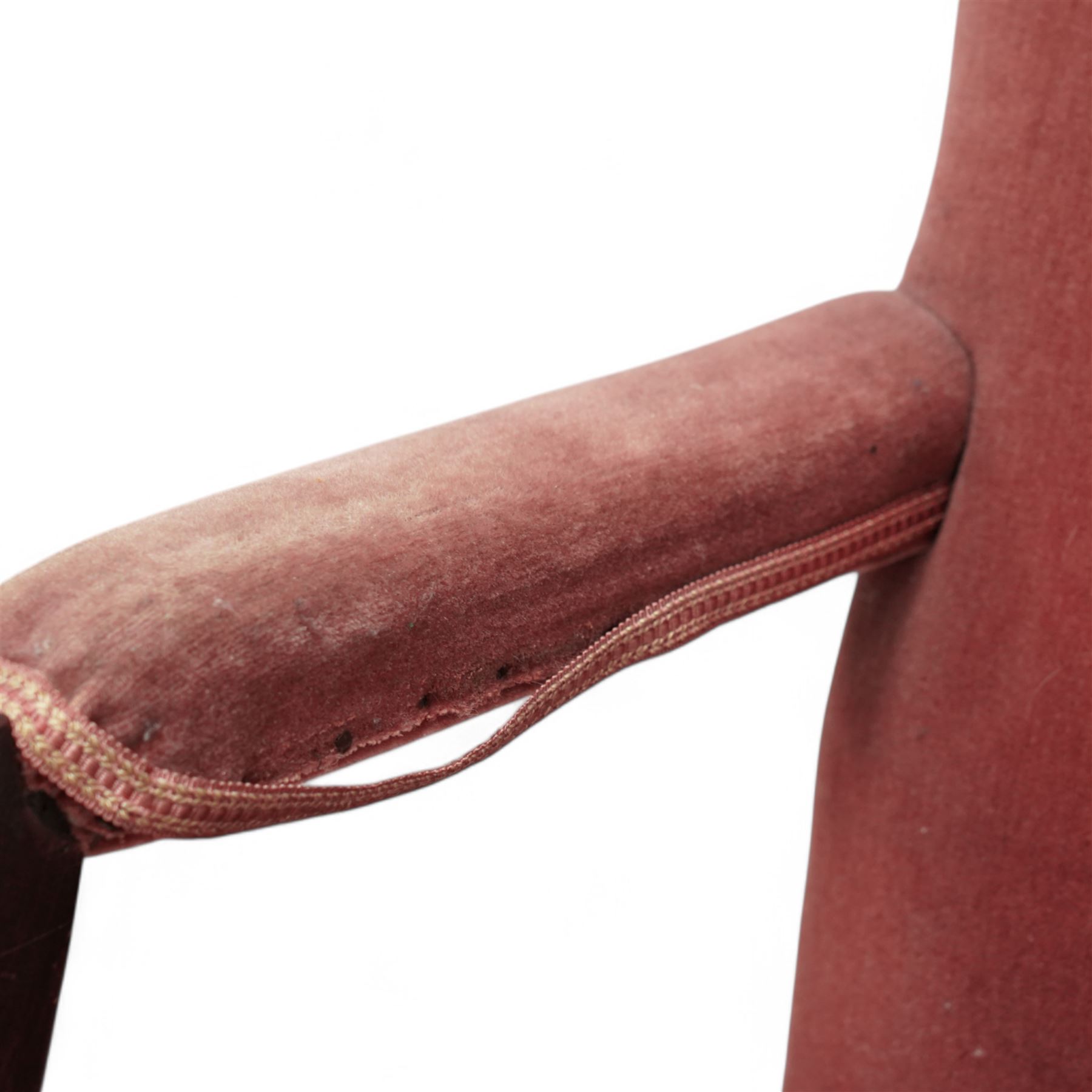 Georgian design mahogany Gainsborough chair, upholstered in pink fabric, curved and moulded arm supports, on moulded square front supports united by H-stretchers 