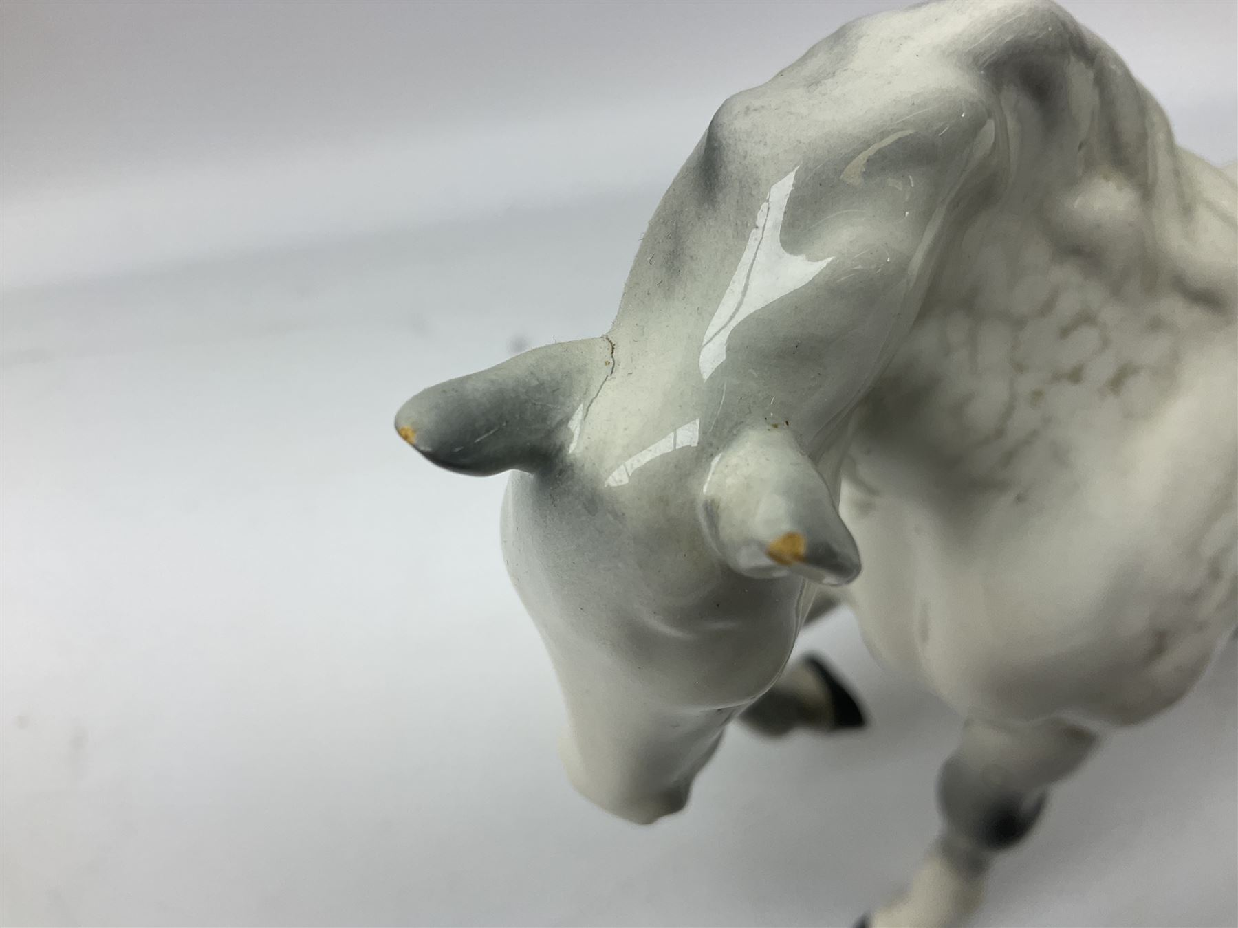 Collection of Beswick horses, including grey horse no.701, palomino foal no 836, grey stocky jogging mare no.855 etc, together two Royal Doulton horses, (8)