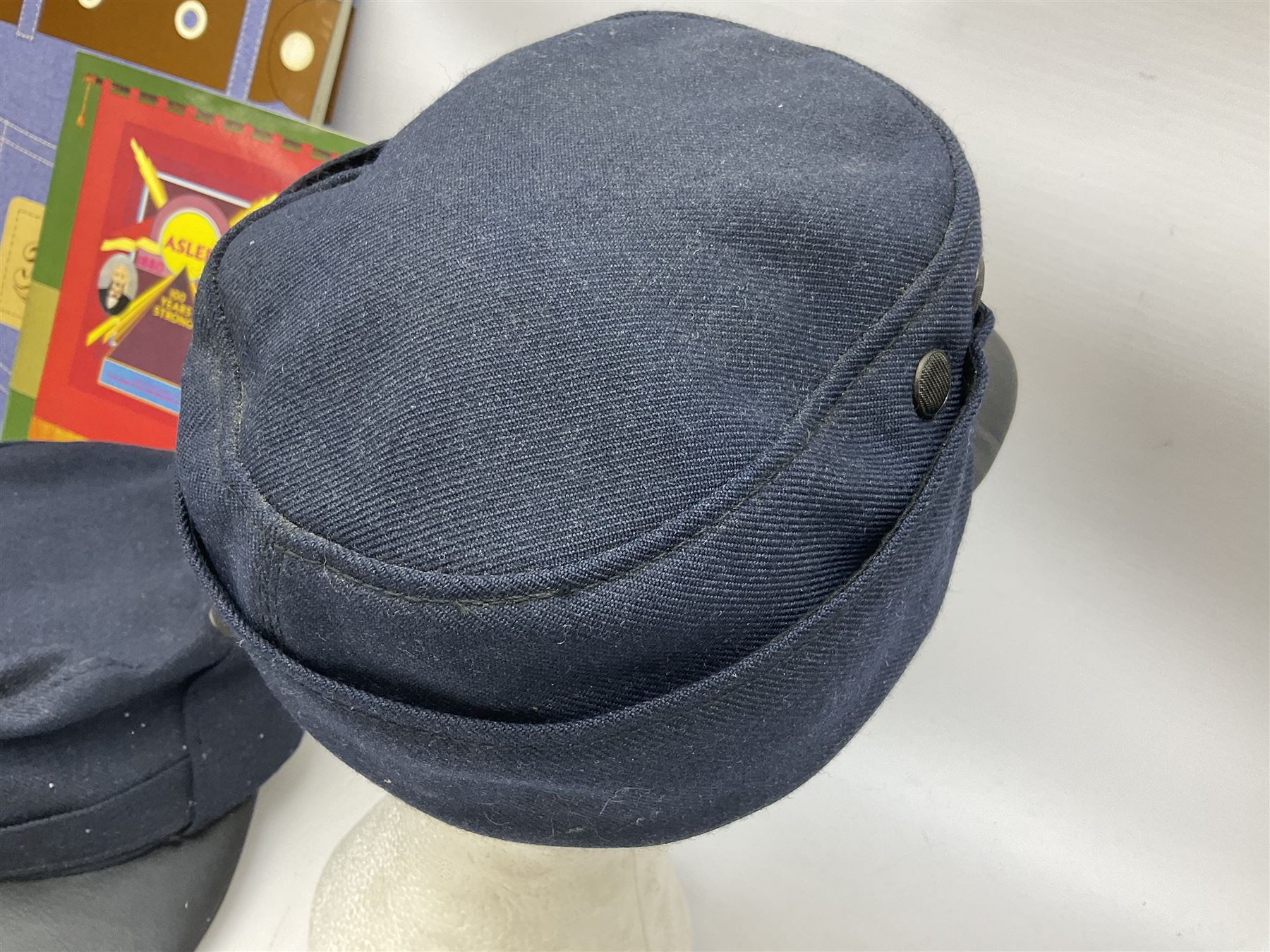 Black painted three colour railway lamp with revolving filters, H29cm; BR Acme Thunderer whistle; three railway peaked caps, two with BR Intercity 125 badge; small album of photographs of railway interest etc