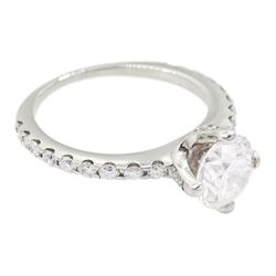 Platinum single stone round brilliant cut diamond ring, with diamond set shoulders and diamond set gallery, principal diamond approx 1.00 carat