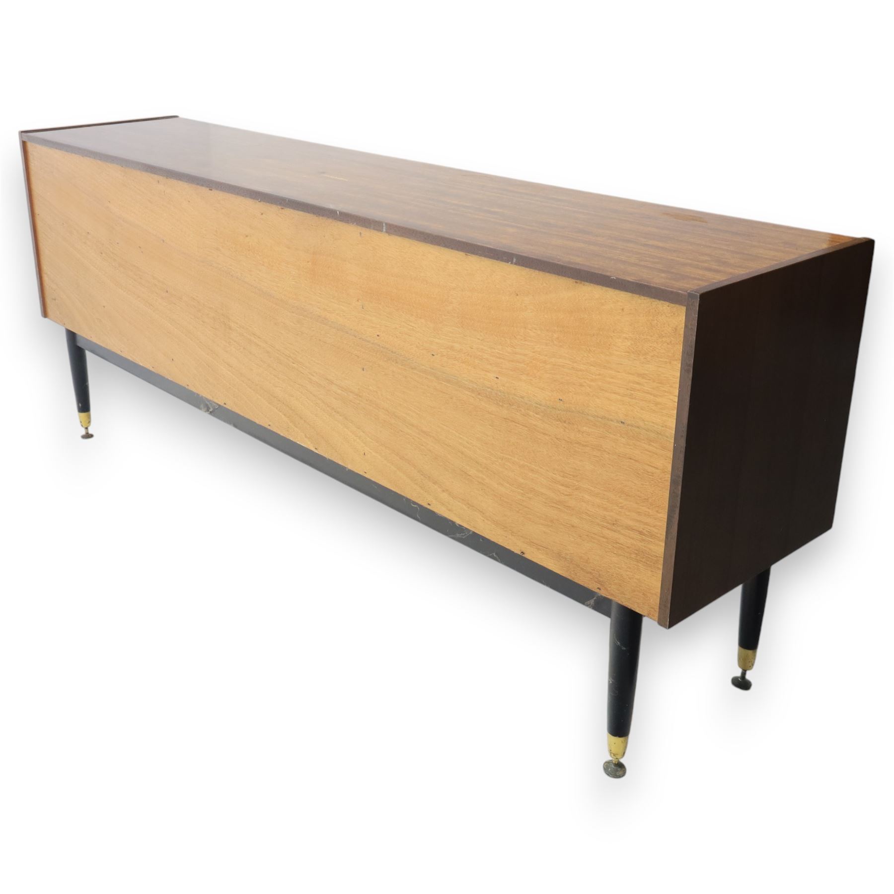 G Plan - ‘Librenza’ tola wood sideboard, the rectangular top above two cupboards to either side and three graduated central drawers, the drawer and door fronts veneered in figured tola wood with brass handles, standing on splayed tapering legs