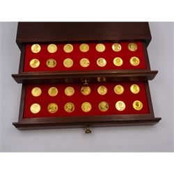 Danbury Mint, Our Royal Sovereigns Collection, seventy 22 carat gold plated silver medallions depicting the complete line of British monarchs to mark the 1200th anniversary of the first coronation, contained within wooden table top collectors cabinet with two drawers, with certificate of authenticity, with two drawers, hallmarked Danbury Mint, London various dates