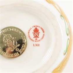 Two Royal Crown Derby paperweights comprising Imari Polar Bear with gold stopper and Sleeping Dormouse, with gold stopper  