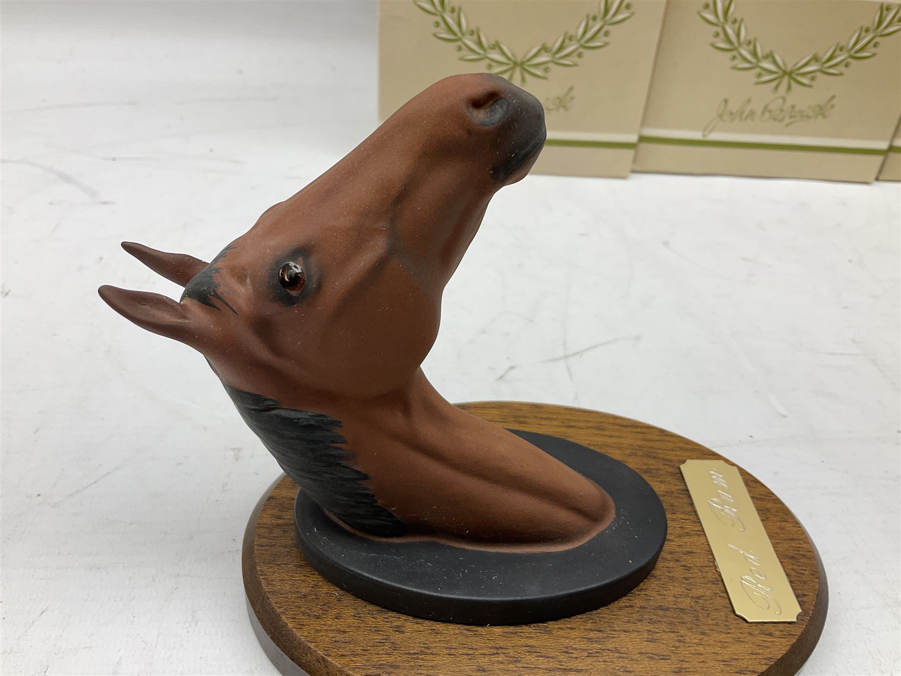 Beswick set of horse head wall plaques 'Champions all', comprising Arkle no.2700, The Minstrel no.2701, Red Rum no.2702, Troy no.2699, all with original boxes