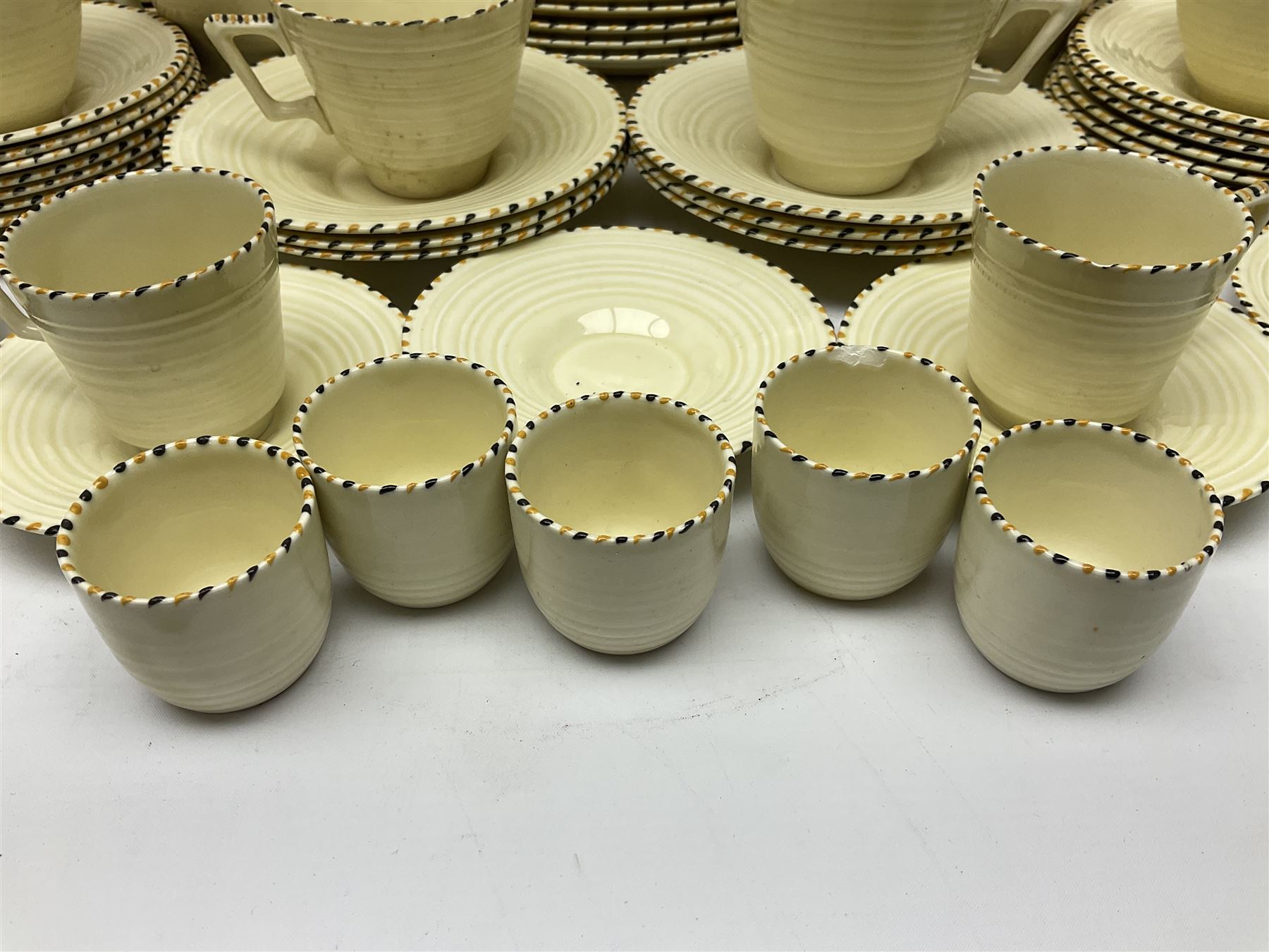 Art Deco Crown Ducal tea and dinner wares, reg no. 784158, comprising dinner plates, teacups, saucers, coffee cups, crescent shaped side plates, bowls, eggcups, etc, (93)