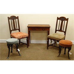  Two early 20th century oak dining chairs, shaped cresting rail, carved splat, upholstered seat, square tapering supports (W47cm), a mahogany folding tea table, single drawer (W76cm, H73cm, D75cm) and two cast iron stools (D38cm, H47cm) (5)  