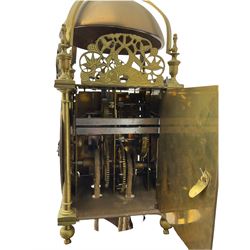 A 20th century replica of a 17th century 30-hour lantern clock with a rope driven verge escapement and countwheel striking, sounding the hours on a bell, with an engraved dial centre, silvered chapter ring and Roman numerals , half hour and quarter hour markers and a pierced and fettled steel hand, with an attached disc engraved “ Clockmaker In Scarborough Ivan Coe, Fecit,”, with engraved side doors, brass finials and dolphin fretwork, on a wooden bracket with pulley.   No weight.
Clocks similar to this were usually individually constructed by engineers working from plans of clocks designed by Claude Reeve, John Wilding, Malcolm Timings and other well-known clockmakers/engineers. 
