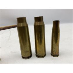 WW2 copper and brass bugle inscribed George Potter & Co, Aldershot 1939 L28cm; two cane and one leather covered swagger sticks; and three small pairs of plain brass shell cases (10)