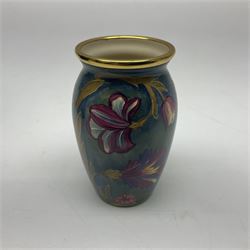 Moorcroft enamel vase, decorated with flowers on a green ground, in fitted box, H7cm