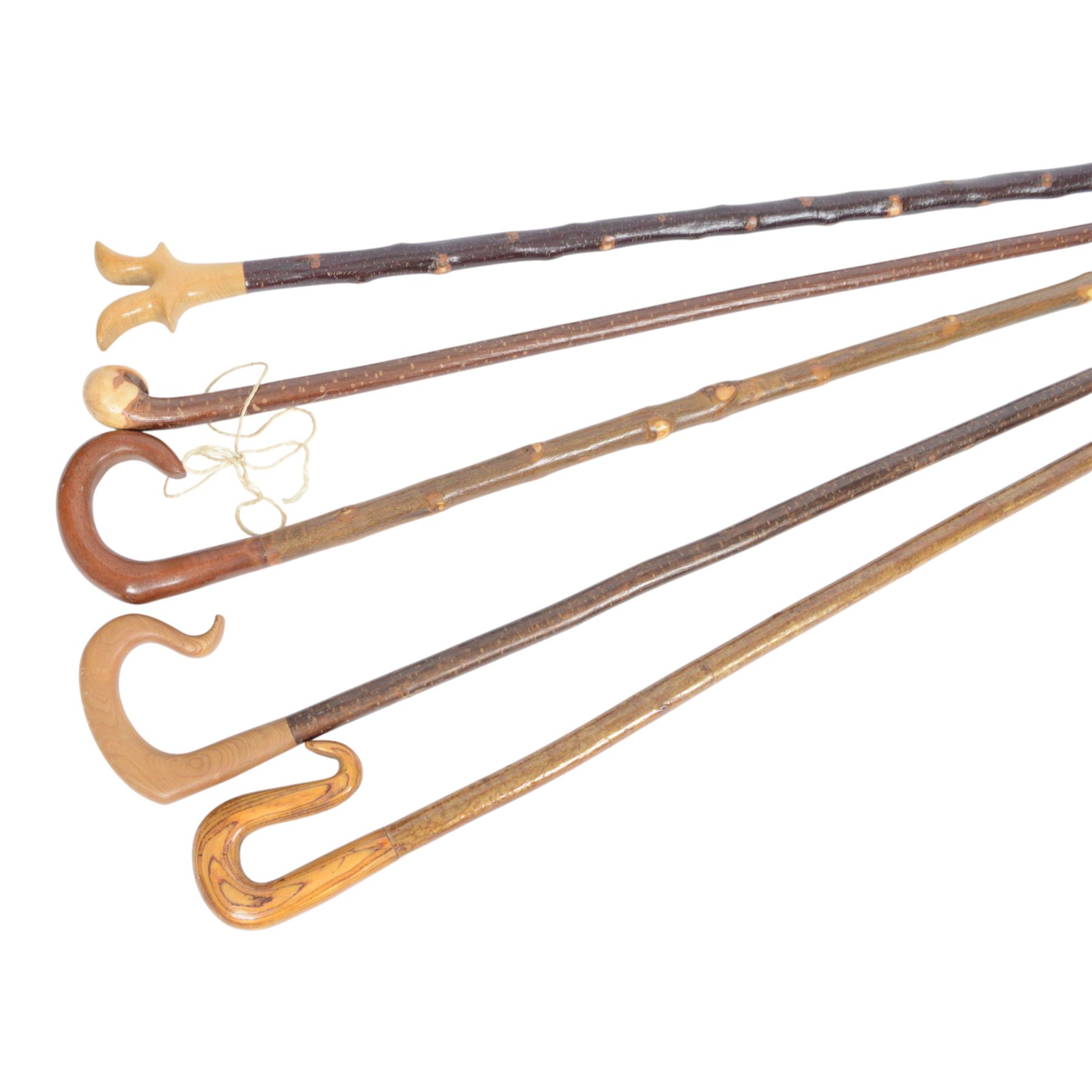 Five walking sticks, to include thumb stick and crooks 