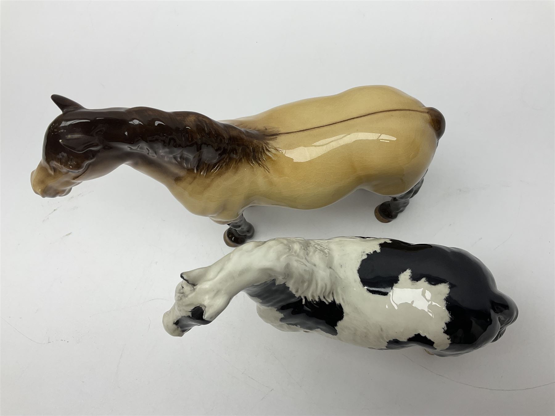Beswick dun Highland pony no 1644 and piebald Pinto Pony  no 1373, both with printed mark beneath