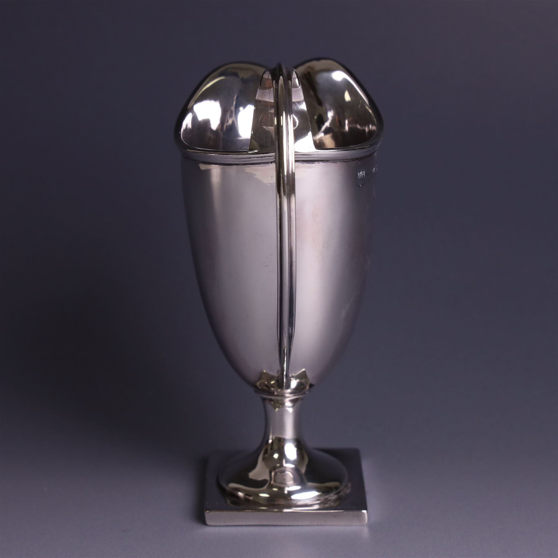 Edwardian silver helmet shaped cream jug, with plain bowl and upon a square base, hallmarked D & M Davis , Chester 1901, H13cm