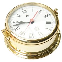 Three 20th century 8-day spring driven mantle clocks and a 20th century brass cased ships clock with a sweep seconds hand.