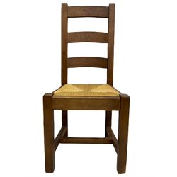 Antix French oak dining table with two leaves, two frieze drawers;, and six ladder back chairs with rush seats