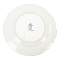 20th century Royal Worcester footed bowl, hand painted with gilt interior, the exterior a still life of fruit upon a mossy ground, signed Freeman, with black printed mark beneath, together with plate side plate and cabinet plate, bowl, H8cm, D13cm