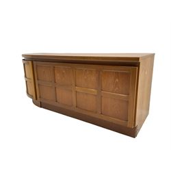 Nathan - mid-20th century teak low corner cupboard, two panelled doors (W64cm H51cm); and matching low cupboard, fall front enclosing two shelves and sliding drawer (H51cm)