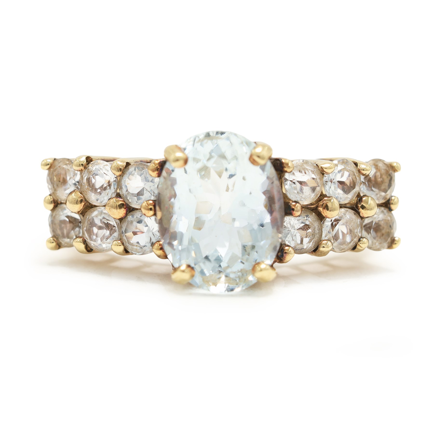 9ct gold aquamarine and blue topaz ring, single oval cut aquamarine, with two rows of round cut topaz's set either side, hallmarked