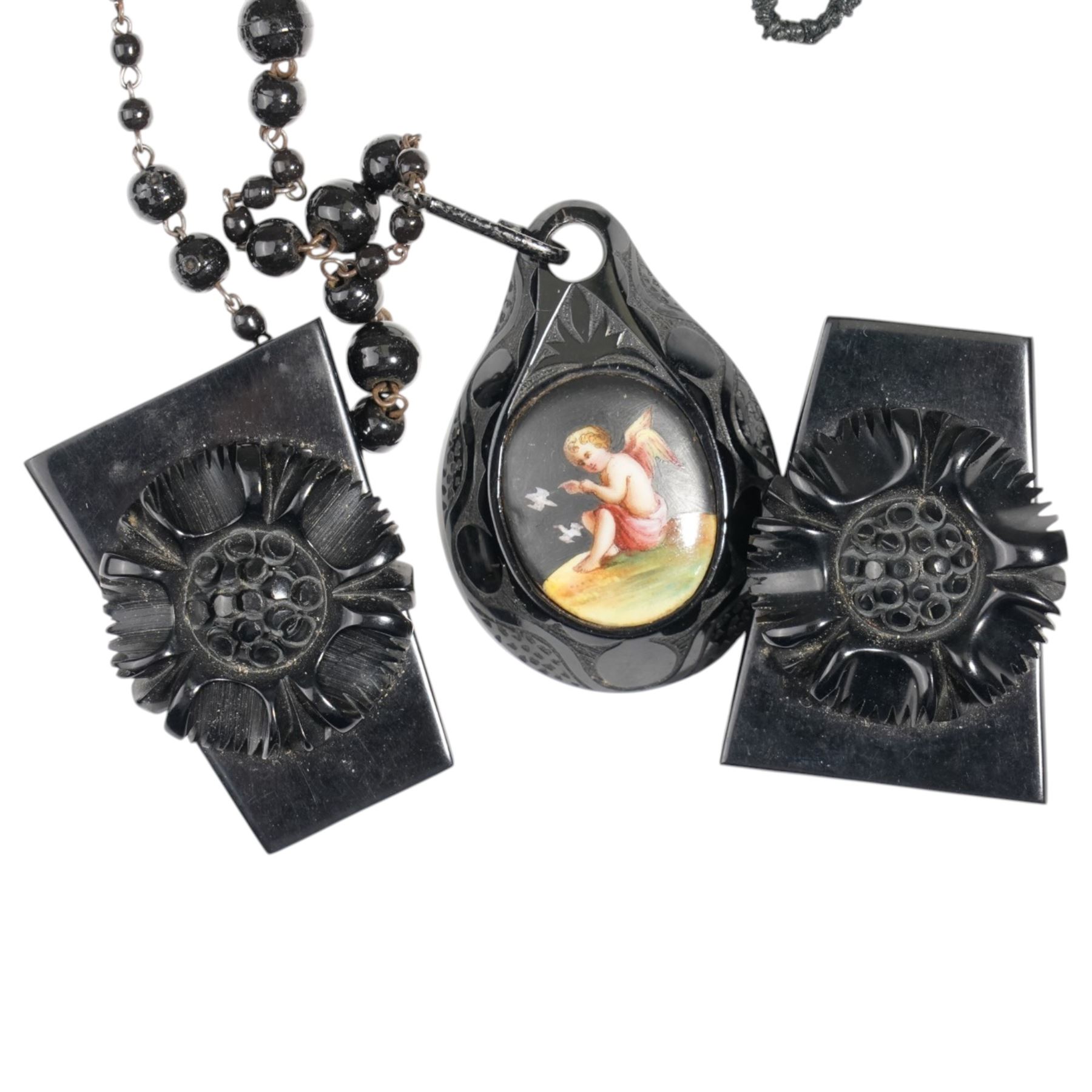 Gilt metal cameo brooch, Madonna and Child enamel pendant, Victorian jet pendant painted with an oval portrait of a cherub on French jet chain, jet collar necklace and jet style clips