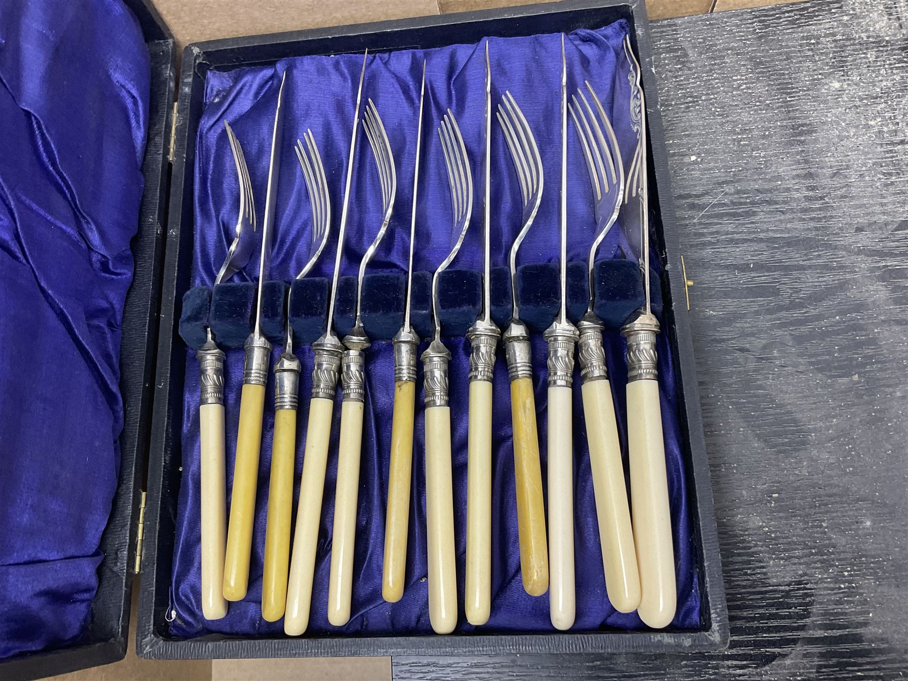 Cased canteens of fish knives and forks, together with part canteen in oak box and various other cased flatware, in two boxes 